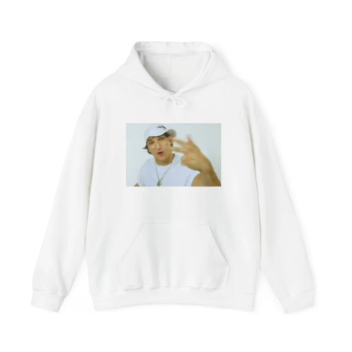 A white hoodie featuring Alex Ovechkin in a white hat and shirt, gesturing with his hand against a light background—perfect for fans of the "Alex Ovechkin Rapping Shirt" trend.
