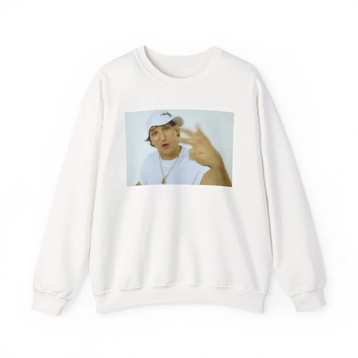 A white "Alex Ovechkin Rapping Shirt" sweatshirt featuring a printed photo of a person in a white cap and T-shirt, gesturing toward the camera against a plain white background.