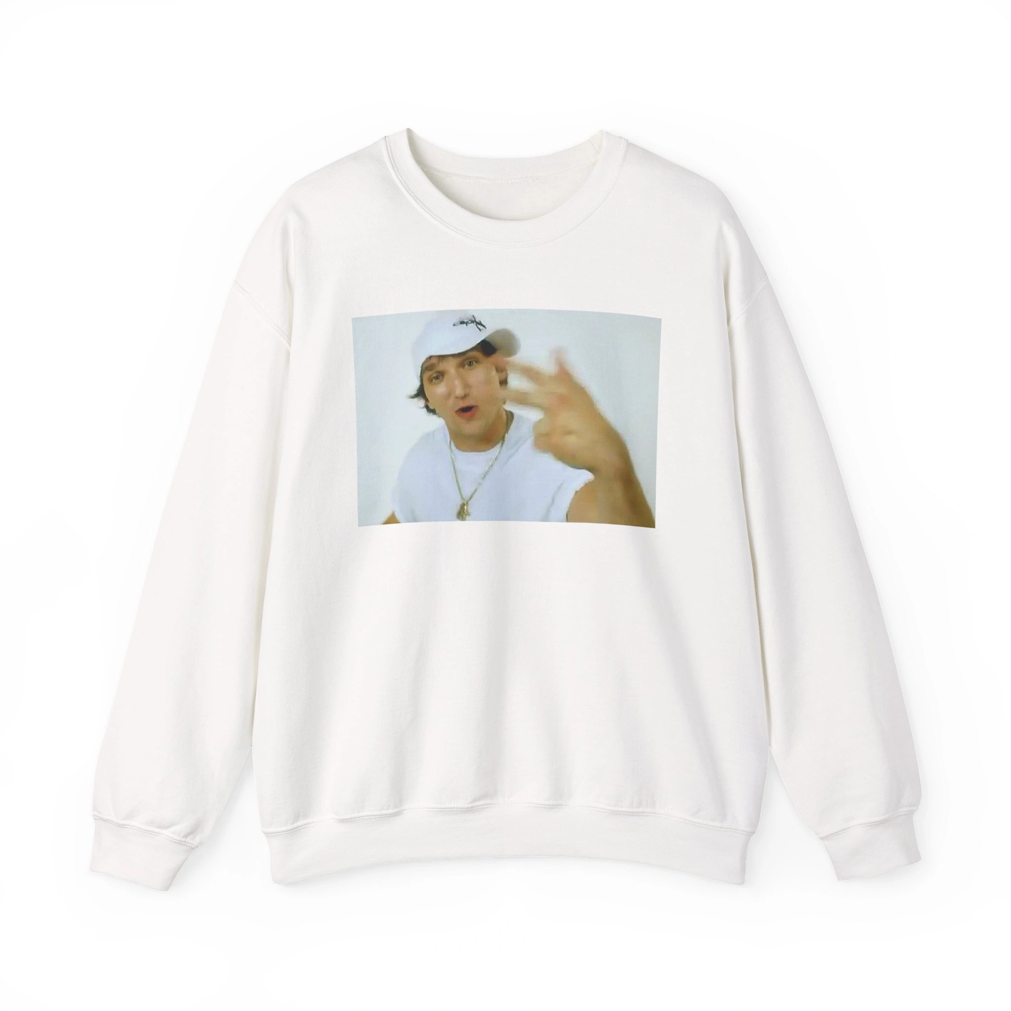 A white "Alex Ovechkin Rapping Shirt" sweatshirt featuring a printed photo of a person in a white cap and T-shirt, gesturing toward the camera against a plain white background. A white "Alex Ovechkin Rapping Shirt" sweatshirt featuring a printed photo of a person in a white cap and T-shirt, gesturing toward the camera against a plain white background.