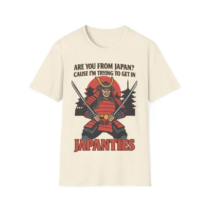 The “Are You From Japan Shirt” is a beige tee featuring a cartoon samurai with two swords, the phrase “Are You From Japan? Cause I'm trying to get in Japanties,” and Japanese-style buildings in the background.