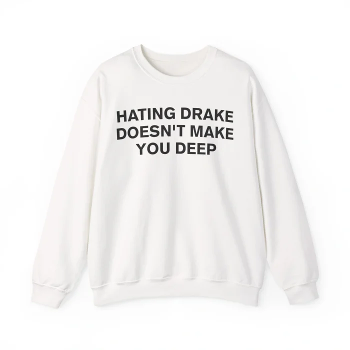 The Hating Drake Doesn’t Make You Deep Shirt is a white crewneck sweatshirt with bold black text—a playful twist for fans.