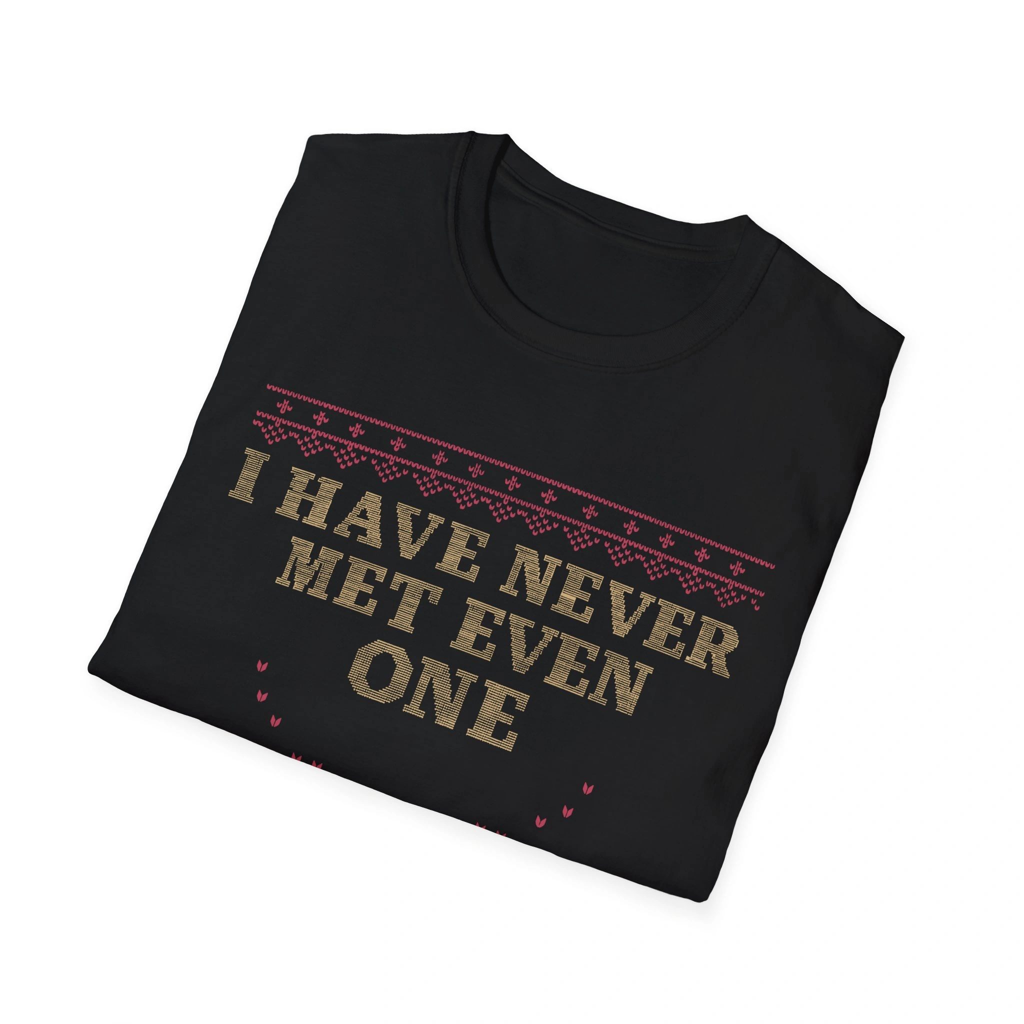 A folded black "I Have Never Met Even One Wise Man Shirt" with gold text that reads "I HAVE NEVER MET EVEN ONE" and a decorative pink pattern above the text. A folded black "I Have Never Met Even One Wise Man Shirt" with gold text that reads "I HAVE NEVER MET EVEN ONE" and a decorative pink pattern above the text.