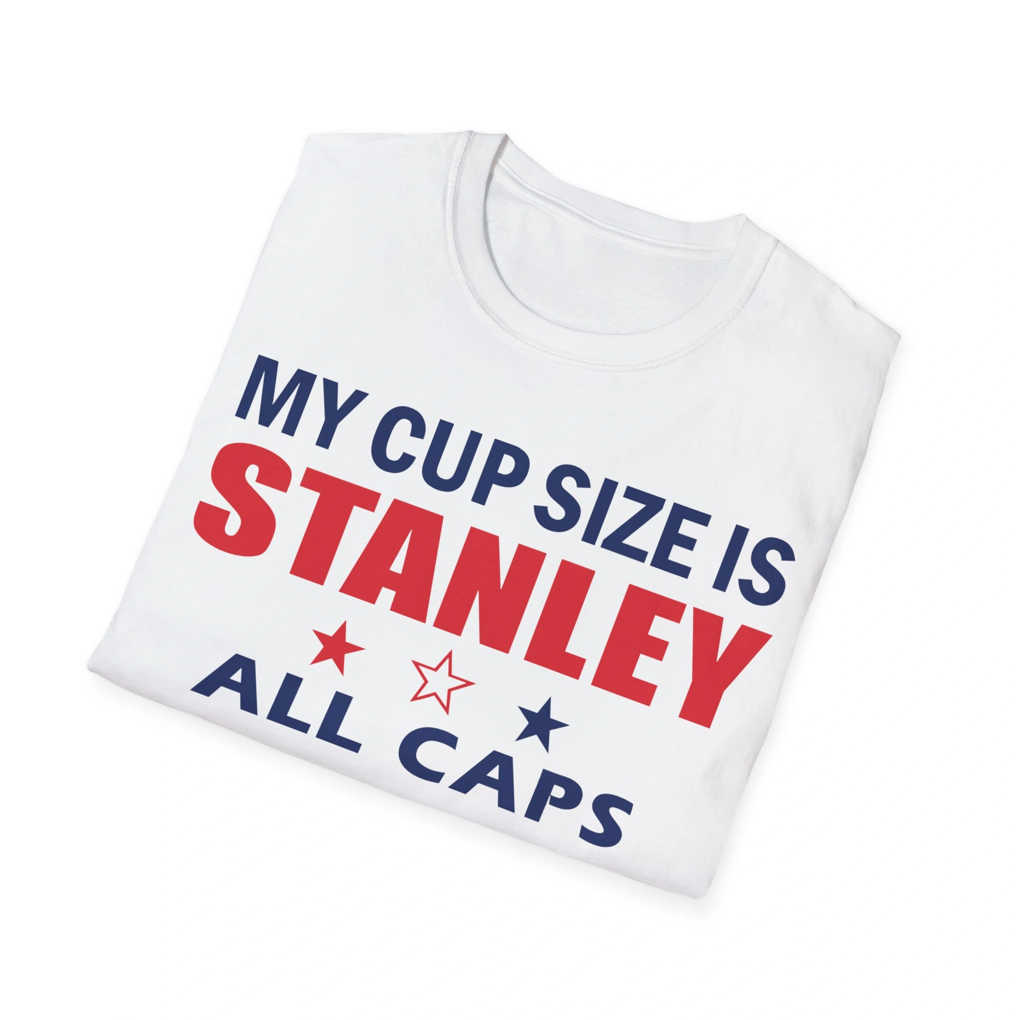 A folded white My Cup Size Is Stanley All Caps Shirt features bold blue and red lettering with matching stars—ideal to pair with your favorite Never Forget Greek Architecture Shirt. A folded white My Cup Size Is Stanley All Caps Shirt features bold blue and red lettering with matching stars—ideal to pair with your favorite Never Forget Greek Architecture Shirt.