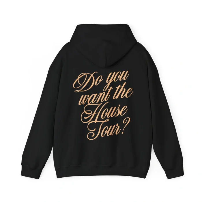 The Sabrina Carpenter House Tour Shirt is a black hoodie featuring tan cursive text on the back that says, "Do you want the House Tour?.