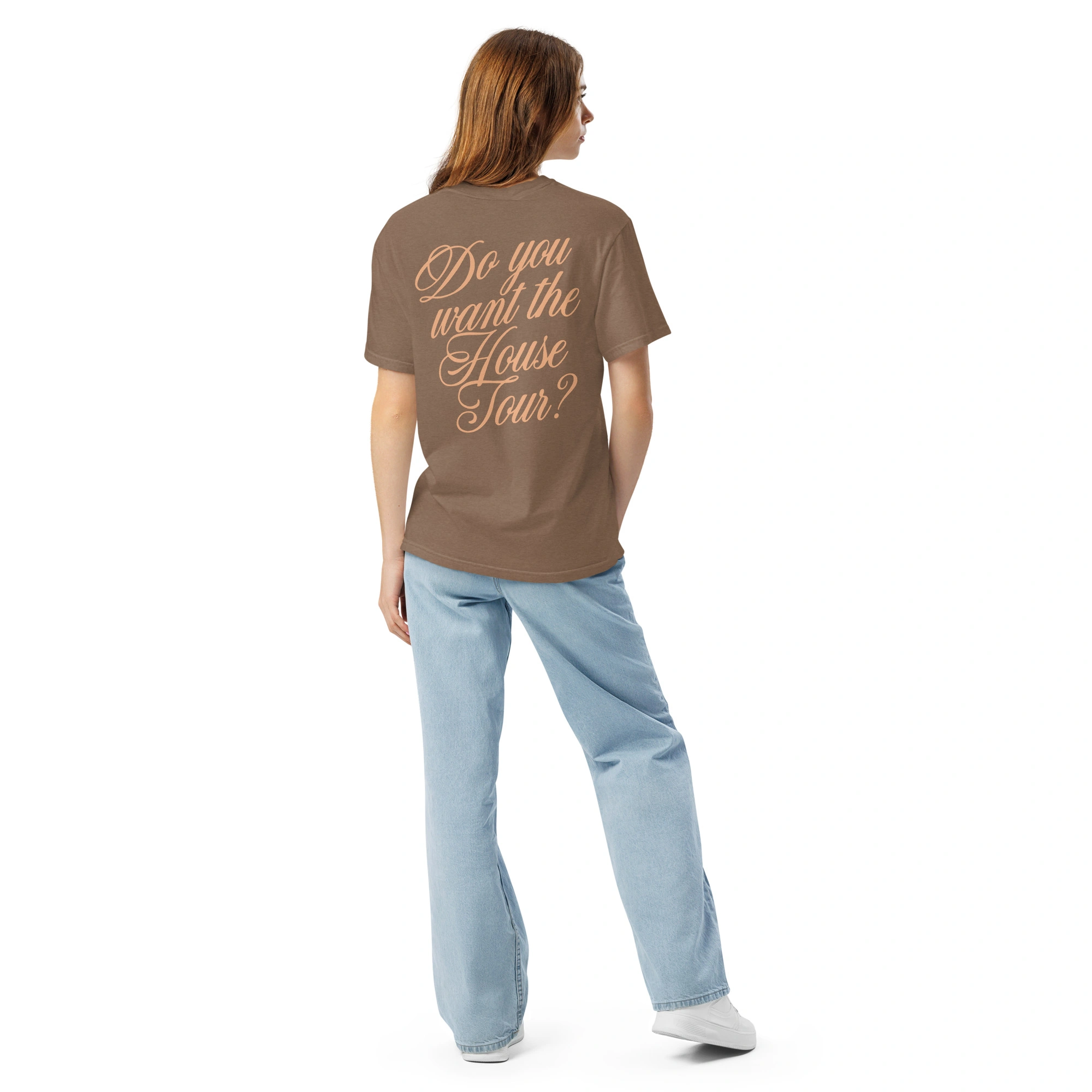 A person with long hair, dressed in the Sabrina Carpenter House Tour Shirt (brown, with “Do you want the House Tour?” in cursive on the back), light blue jeans, and white shoes stands facing away against a plain white background. A person with long hair, dressed in the Sabrina Carpenter House Tour Shirt (brown, with “Do you want the House Tour?” in cursive on the back), light blue jeans, and white shoes stands facing away against a plain white background.