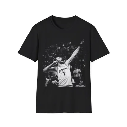Black Luke Kornet Shirt featuring a black-and-white image of a basketball player in a Spurs jersey, joyfully pointing upward with one hand and holding the other near his face.