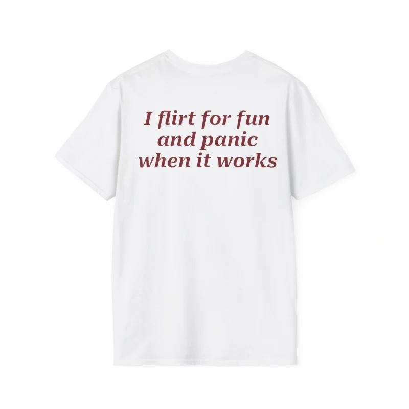 The I Flirt For Fun And Panic When It Works Shirt is a white tee with bold maroon text on the back—ideal for anyone who enjoys playful style and a touch of humor.