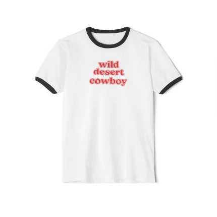 The Wild Desert Cowboy Shirt is a white ringer tee with black collar and sleeve trim, featuring bold red text on the front—perfect for fans of edgy styles like the J'adore a Whore Shirt.