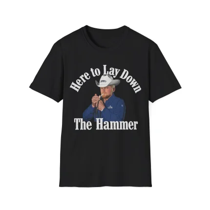 The Here To Lay Down The Hammer Shirt is a black tee with bold white text and a graphic of a man in a cowboy hat holding a tool, ideal for fans of the Sam Darnold Middle Finger Shirt style.