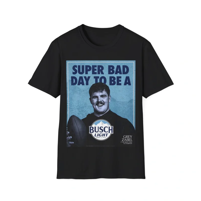 The Super Bad Day to Be a Busch Light Shirt is a black tee featuring a photo of a man holding a football, "SUPER BAD DAY TO BE A" text above, and a Busch Light logo below partially covering his body.